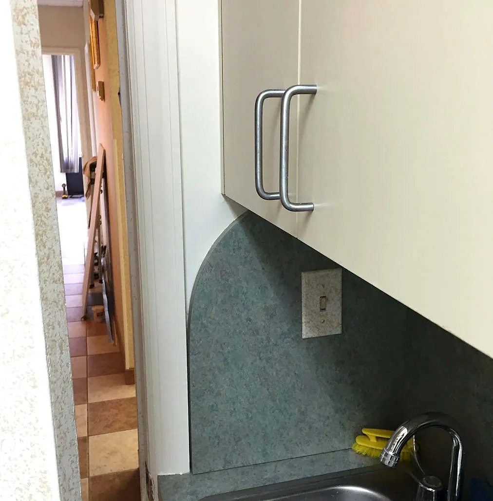 Refinished cabinet faces in a warm off-white