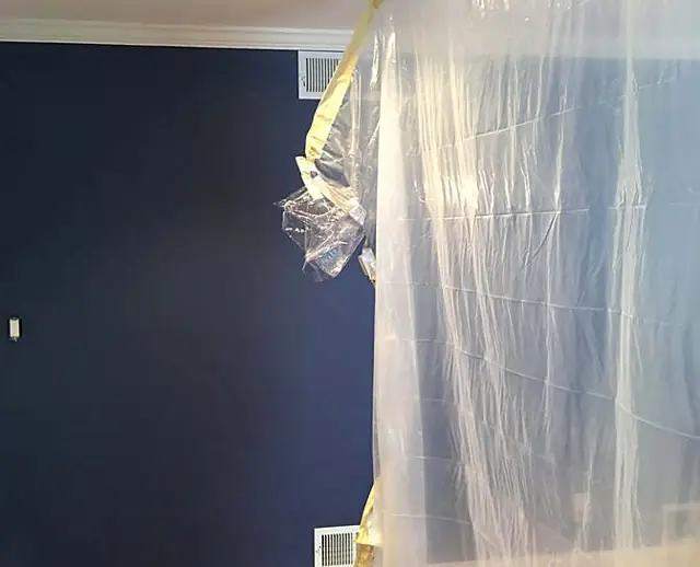 Navy, charcoal, and white millwork — Navy wall, protection in place